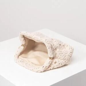 Cream textured clutch bag